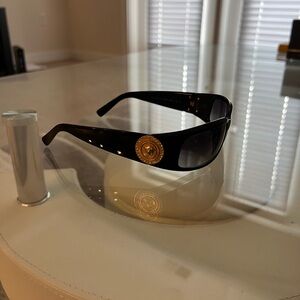 Men’s Sunglasses. Black lens. Box and case included. Glasses in mint condition